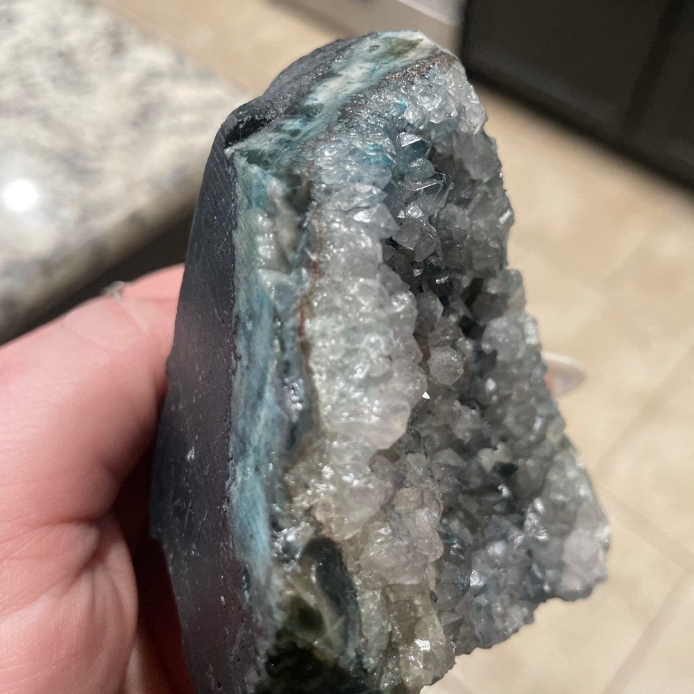 Hand-sized natural blue chalcedony agate geode with druzy quartz